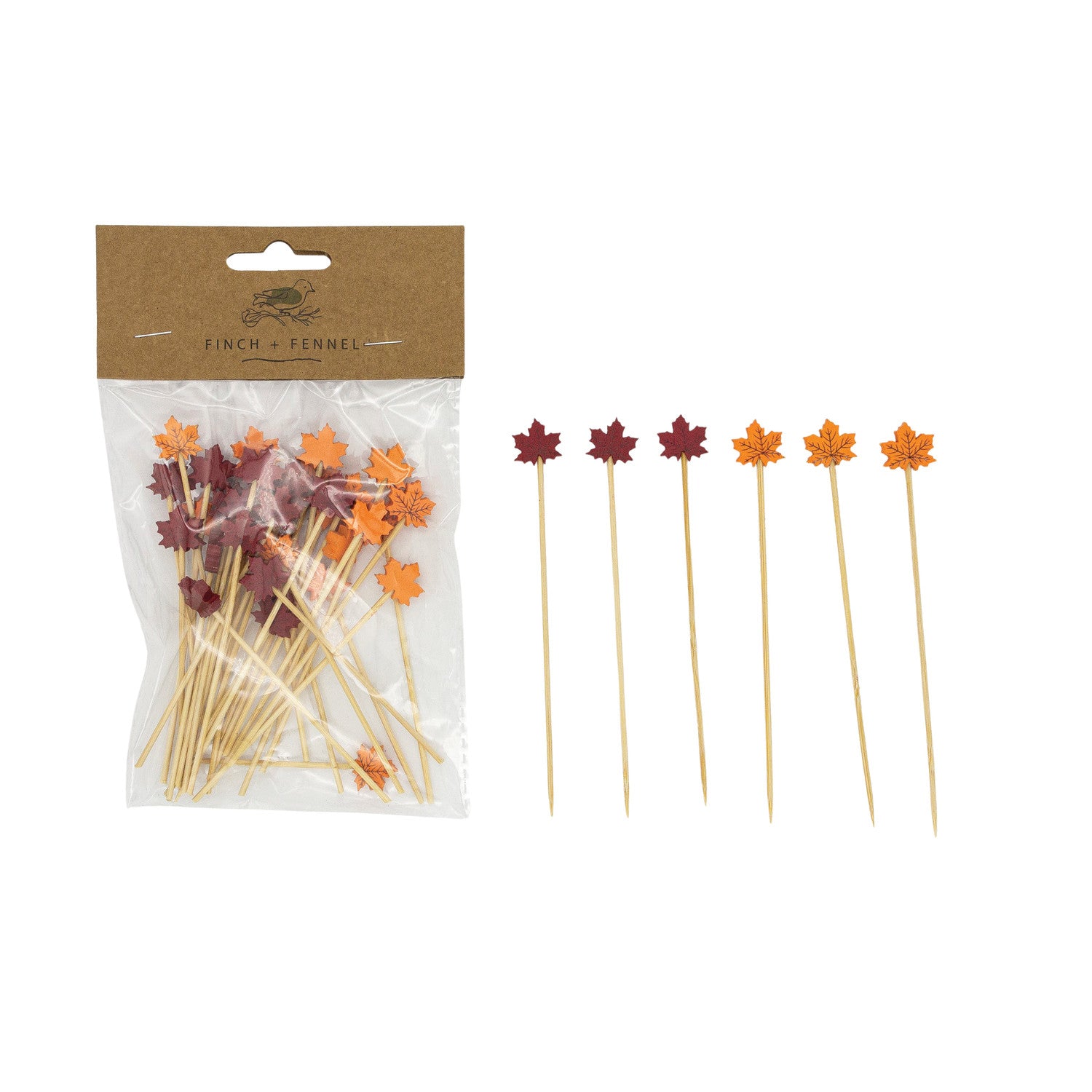 Packaged skewers with leaf decorations on a white background